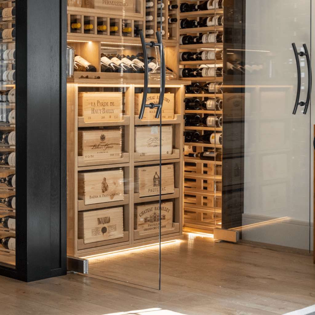 bespoke handles and glass doors for a dark wood wine room