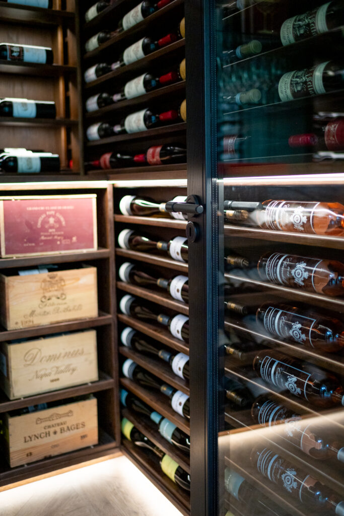 a Sorrells custom wine rack with scallop racking and wooden cases
