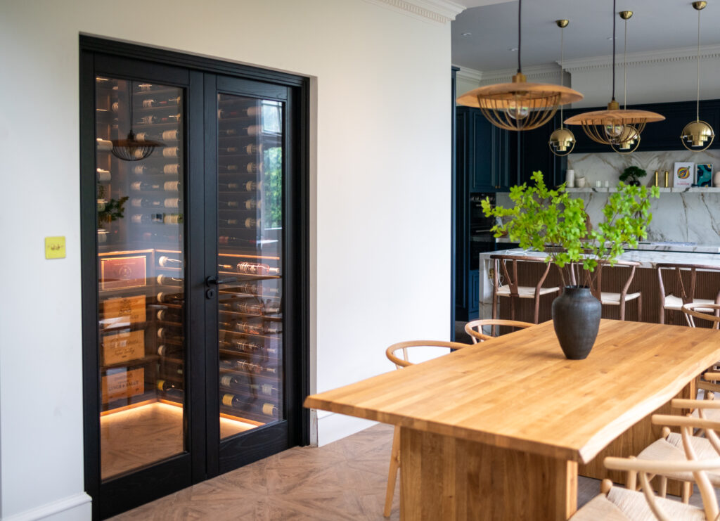 a luxury kitchen with a bespoke wine cellar to suite