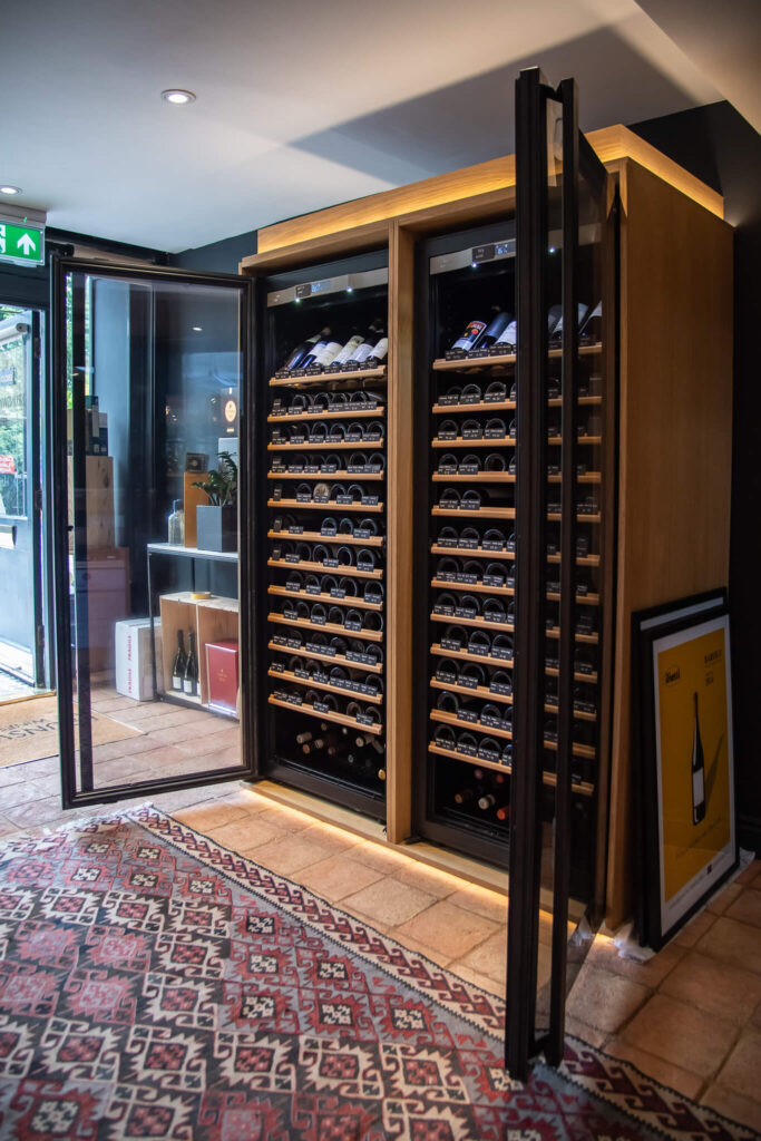 two Transtherm Ermitage wine cabinets, by EuroCave. Sat side by side for a large wine fridge visual