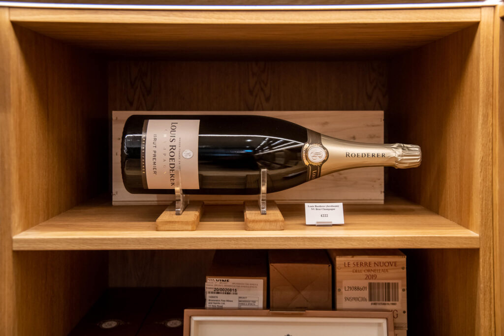a custom made wine holder for a Louis Roederer wine bottle
