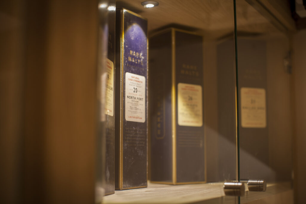 Custom made glass cabinetry for wine bottles