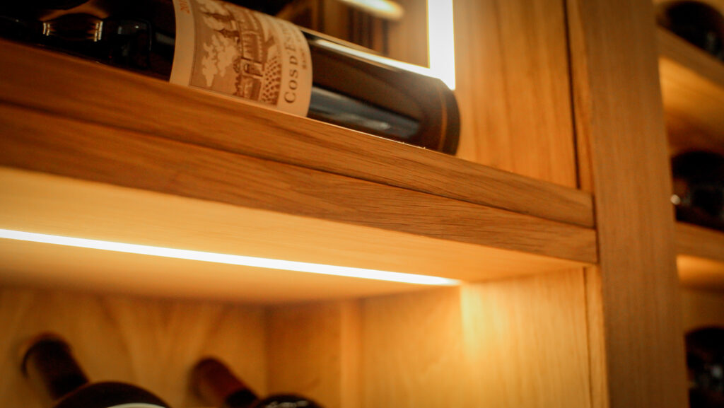 a wine cellar with a close up of the integrated lighting